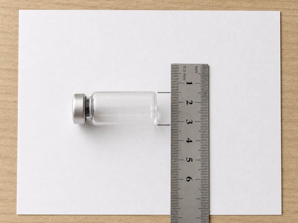 Measuring a vial’s widest diameter with a ruler